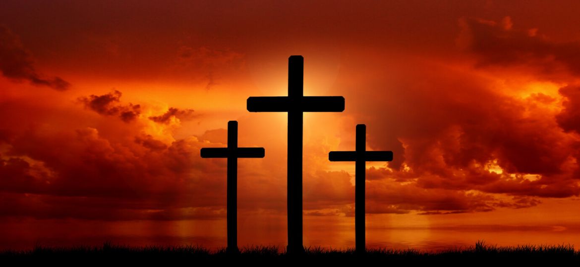Three crosses with sunset.